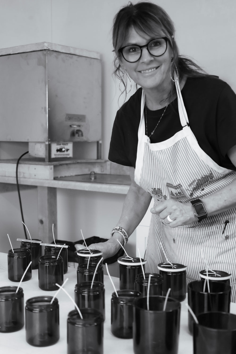 Tracey pouring candles by hand